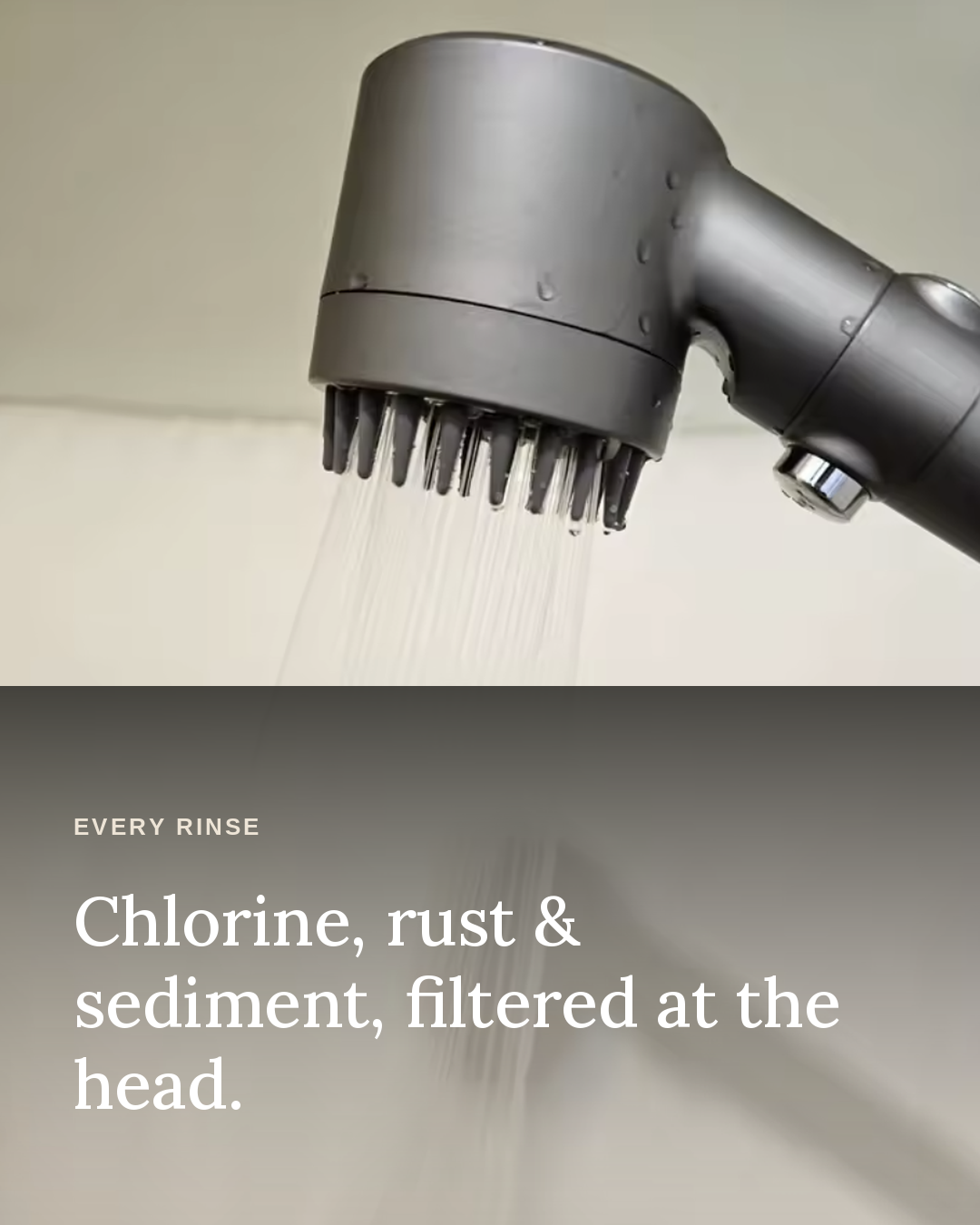 Close-up of water running through the Glowfall showerhead's visible sediment filter