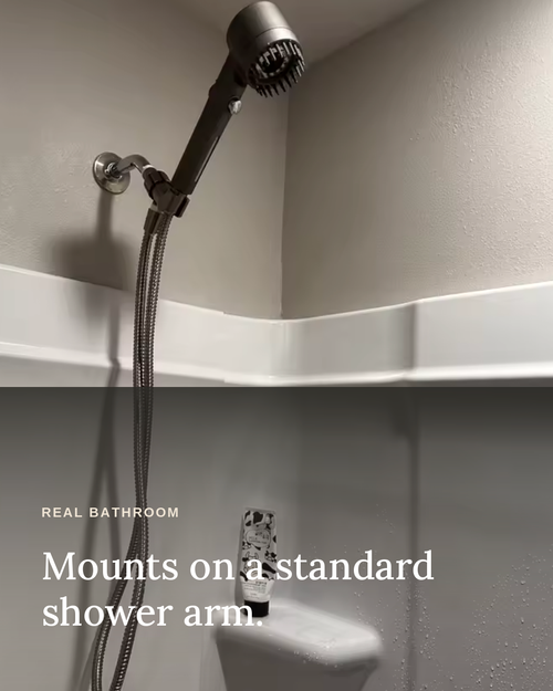 Glowfall filtered showerhead mounted on a standard shower arm in a real bathroom.
